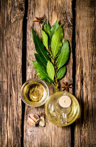 The garlic and the sprig of Bay leaf with olive oil. photo