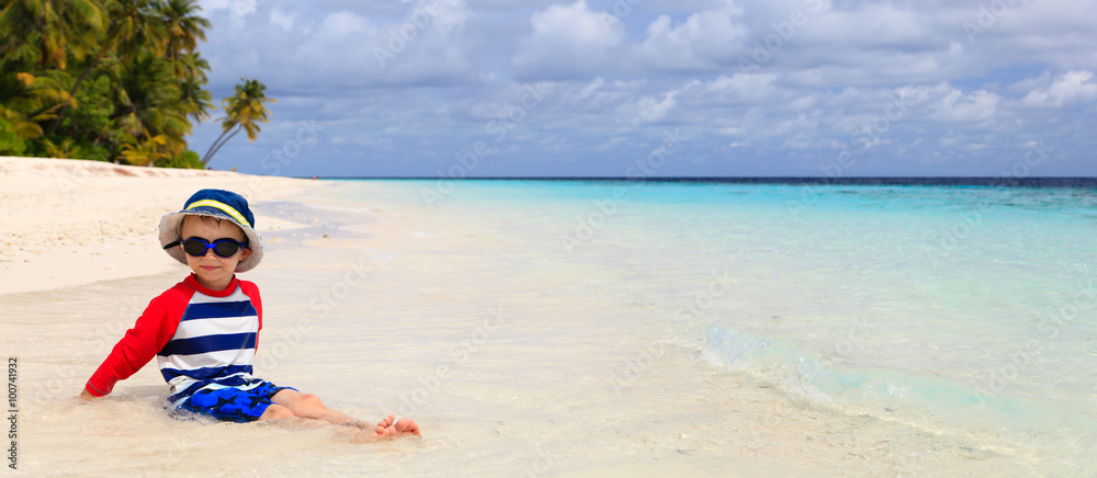 cute little boy relax on tropical beach cute little boy relax on tropical beach