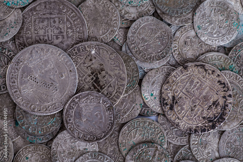 trove of ancient medieval coins silver background
