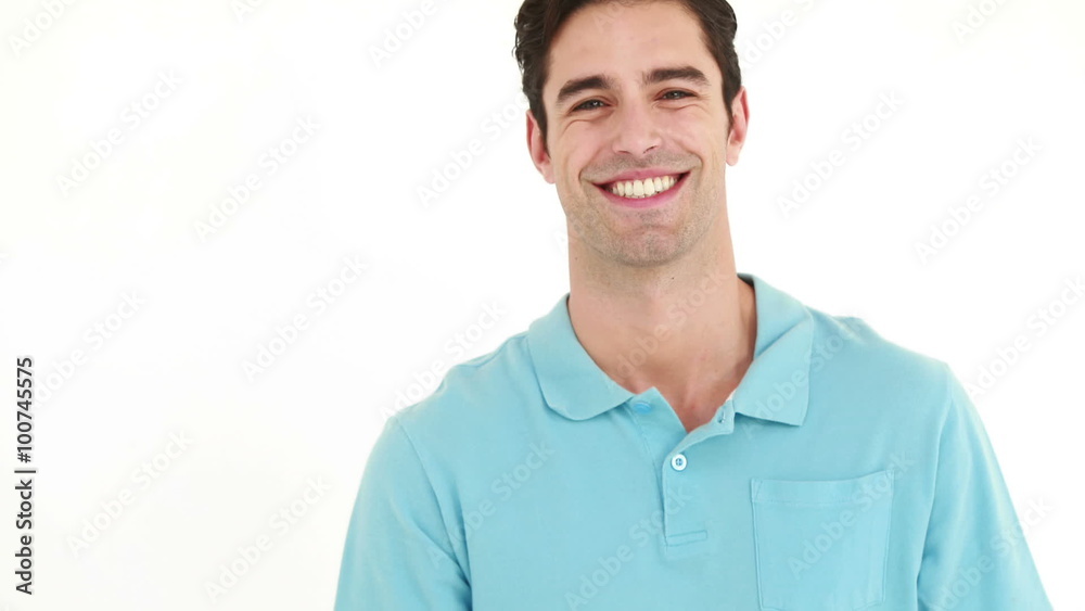 Smiling man playing with badminton racket and showing thumb up Smiling man playing with badminton racket and showing thumb up
