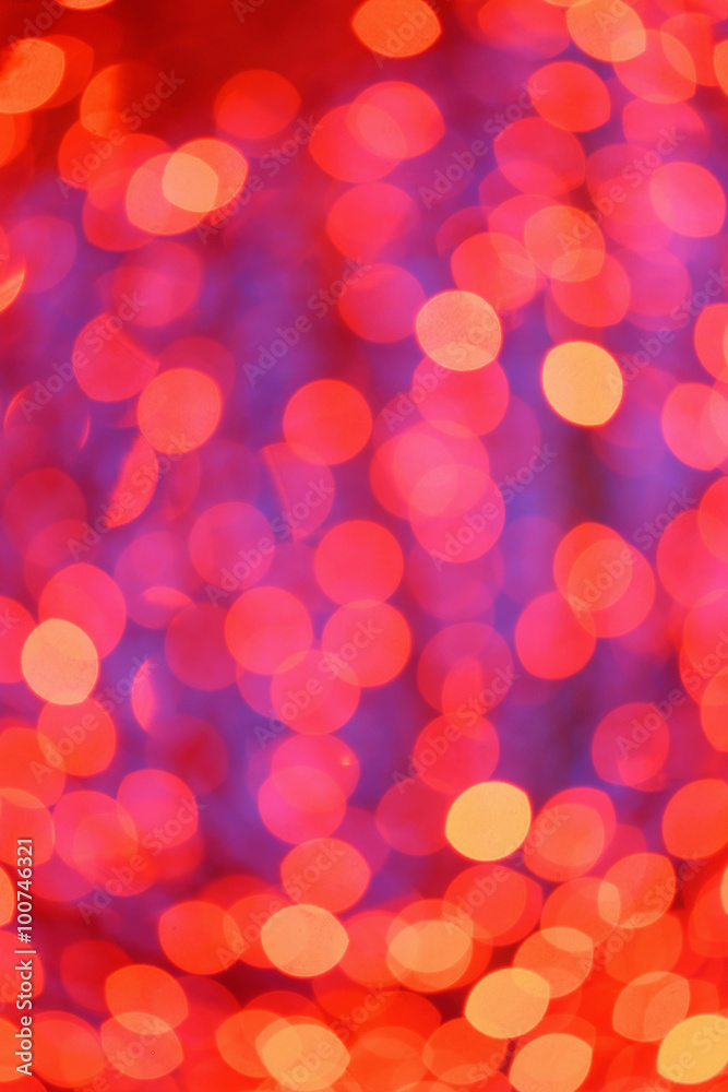Defocused red lights during winter evening in city