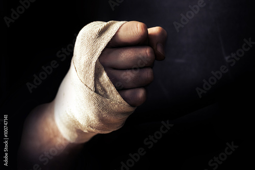 Hand Fist wrapped in bandage, fighting in fighter pose