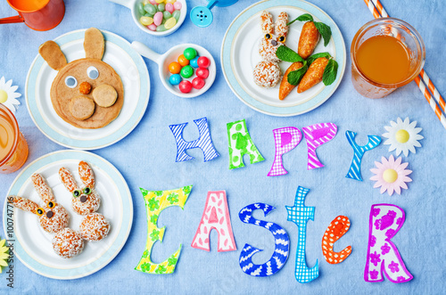 Happy Easter words with sweets and juice for kids