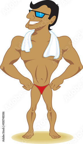 Muscular beach guy poses in swim trunks and towel