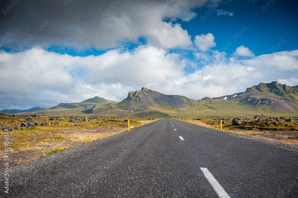 The Ring Road in Iceland. Route 1 or the Ring Road is a national road in Iceland that runs around the island and connects most of the inhabited parts of the country. The length of the road is 1332 km.