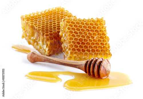 Honeycombs with wooden spoon