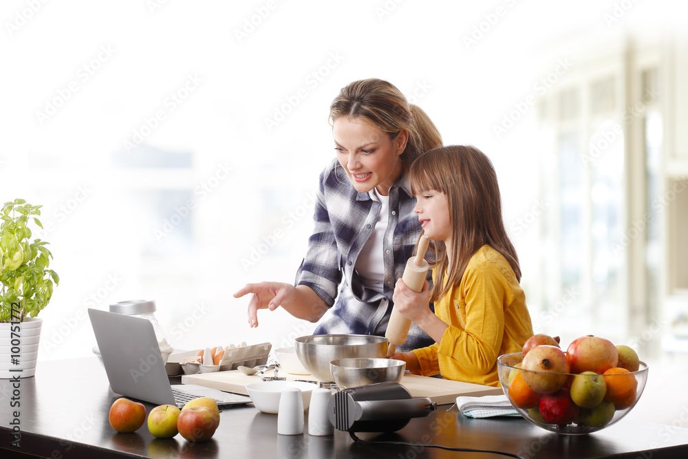 Mother and daugther baking together Mother and daugther baking together