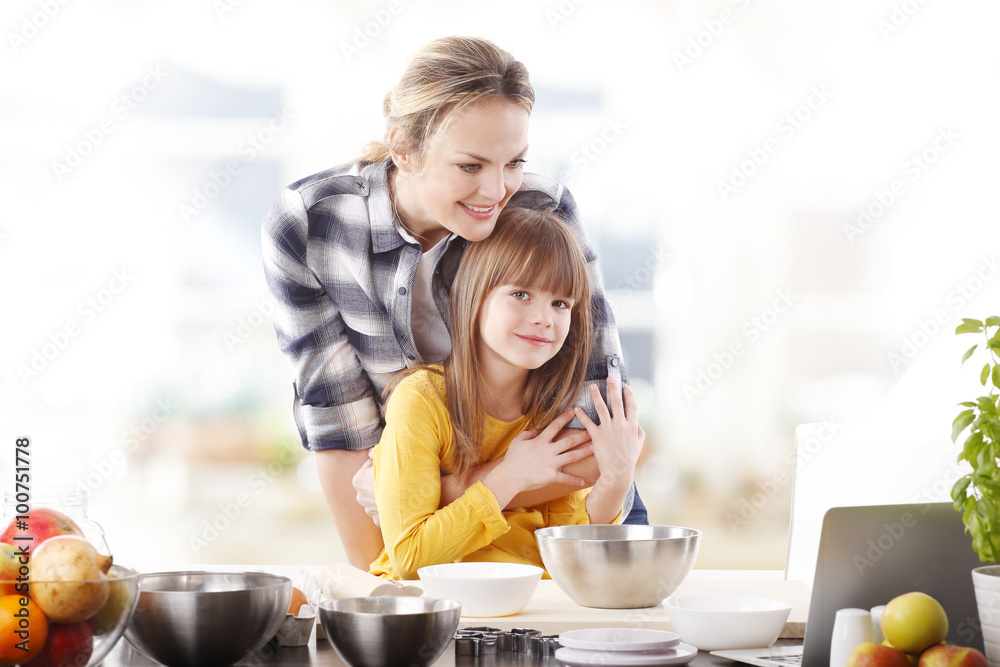 Mother and daugther baking together Mother and daugther baking together