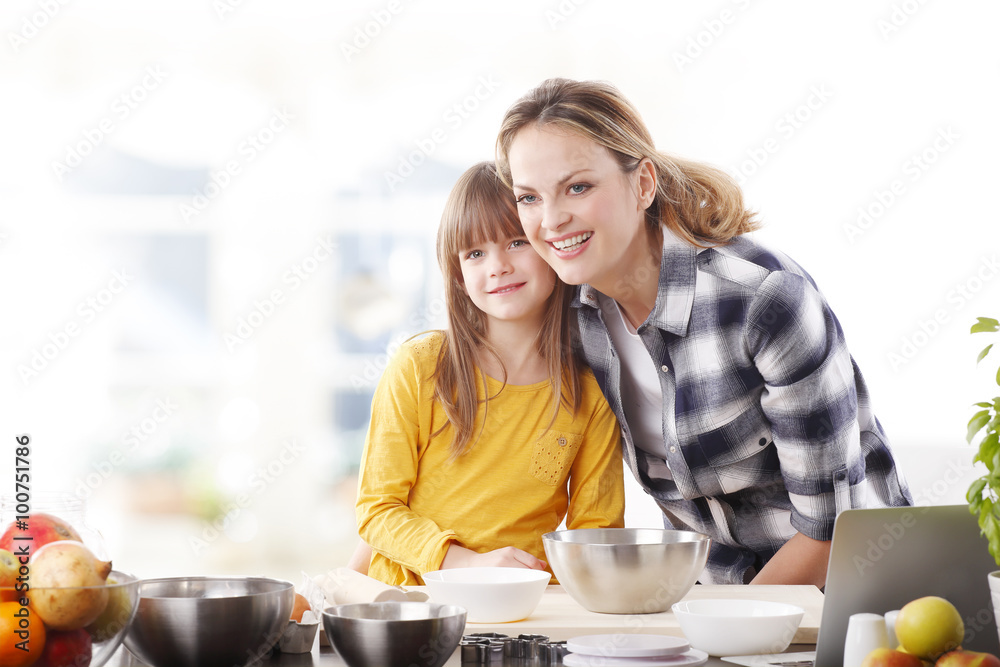Mother and daugther baking together Mother and daugther baking together