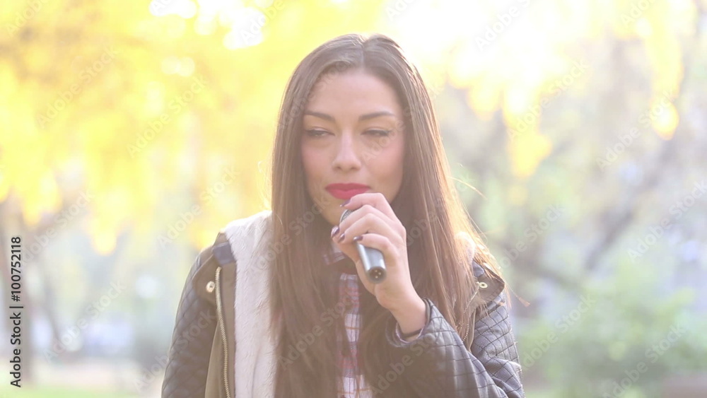 Portrait of beautiful woman singing with microphone Portrait of beautiful woman singing with microphone