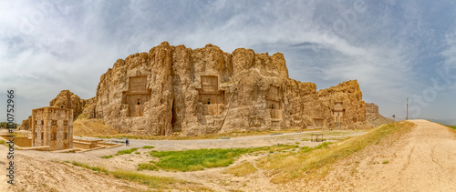 Naqsh-e Rustam Panorama of the historical four tombs belonging to Achaemenid kings and Cube of Zoroaster panorama view. photo