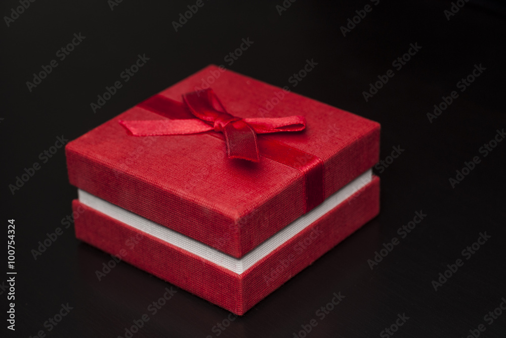 Red box gift on black background Red box gift on black background