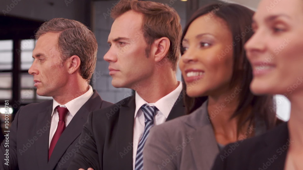 Smiling business people posing together 