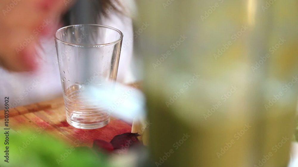 Pouring green smoothie into glass Pouring green smoothie into glass
