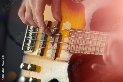 Close Up Playing Bass Guitar