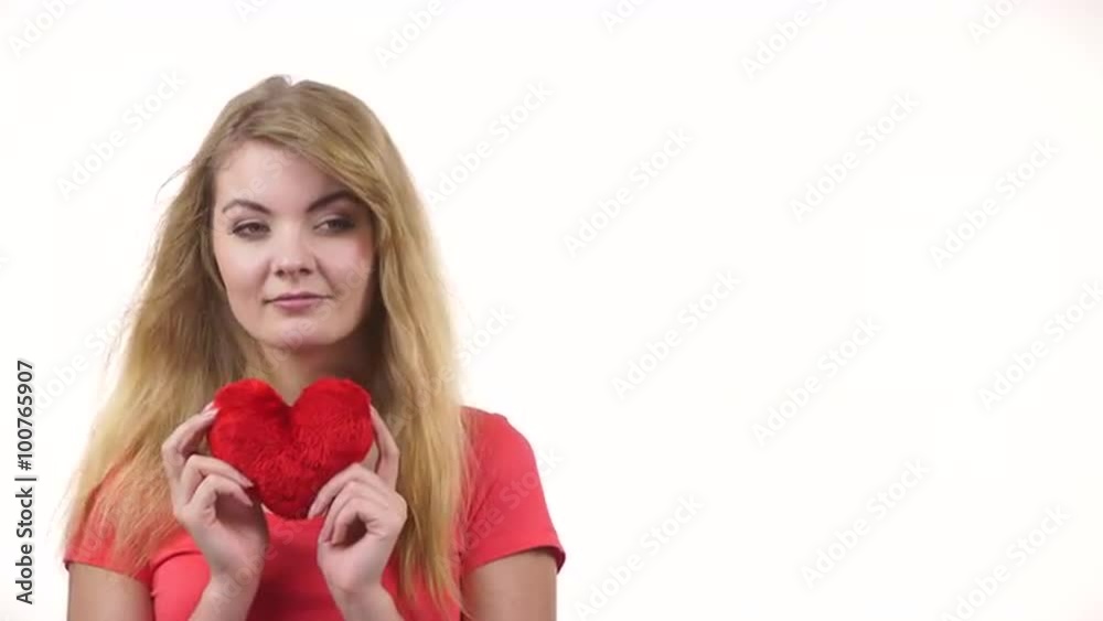 Woman blonde girl holding red heart love symbol 4K Woman blonde girl holding red heart love symbol 4K