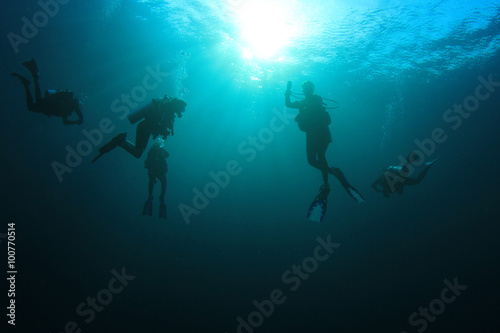 Scuba diving exploring coral reef Similans Thailand