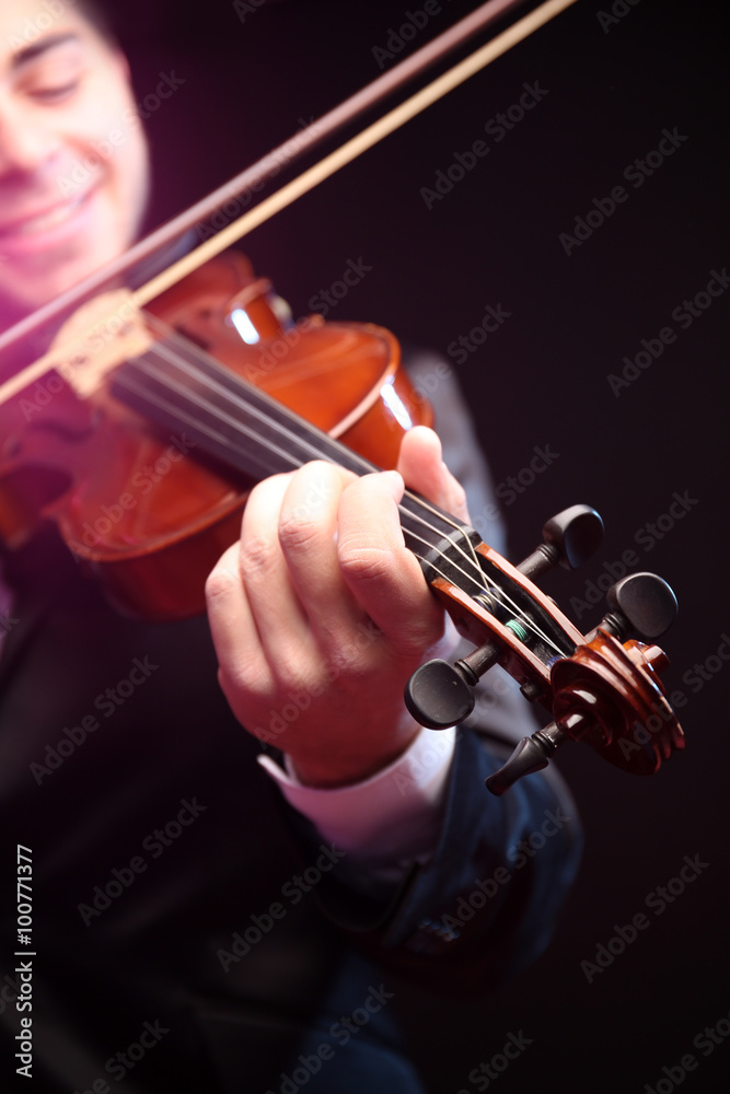 Violinist's performance on black background, close up Violinist's performance on black background, close up