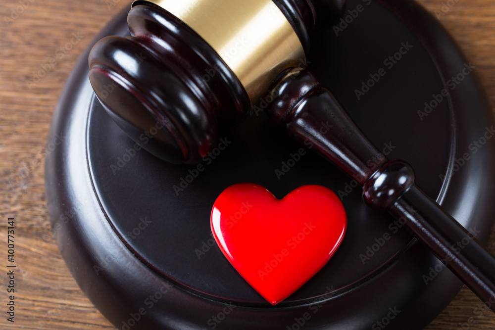 Mallet And Heart On Table In Courtroom Mallet And Heart On Table In Courtroom