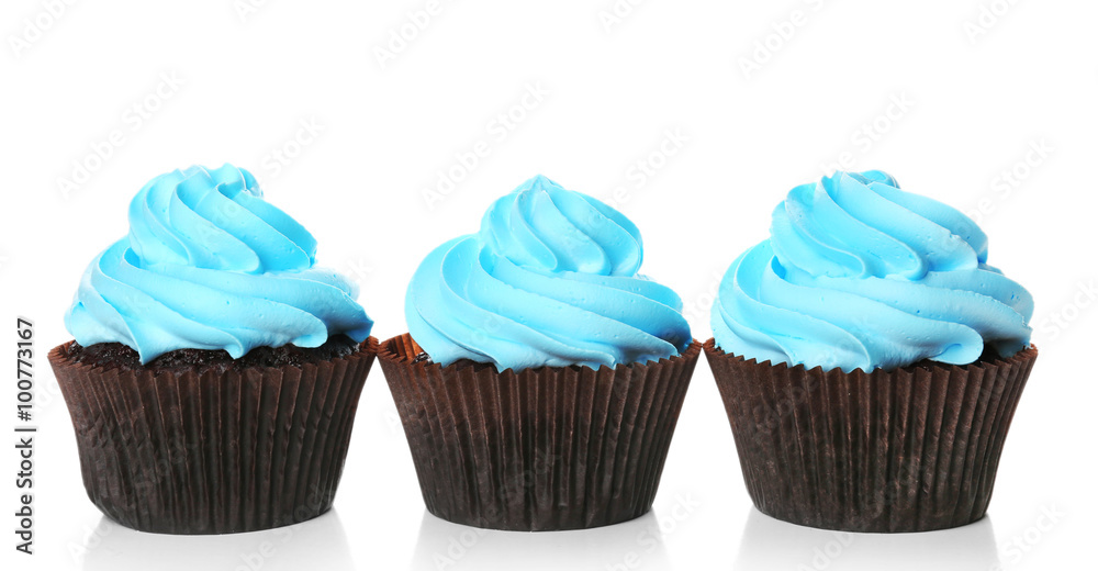 Delicious cupcakes isolated on white background