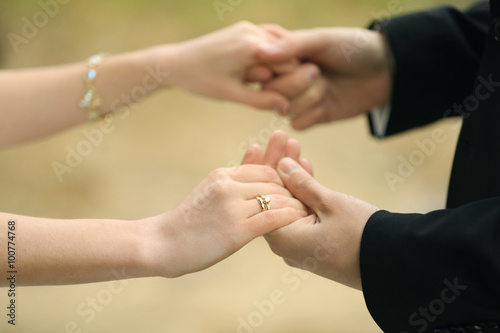 Bride and groom holding hands