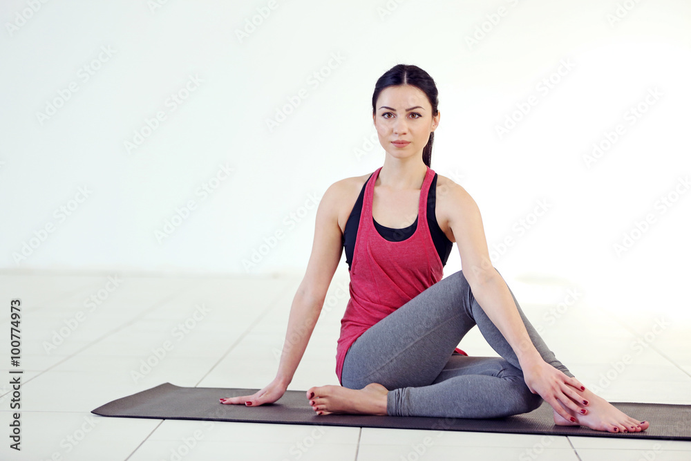 Young attractive woman does yoga in the class Young attractive woman does yoga in the class