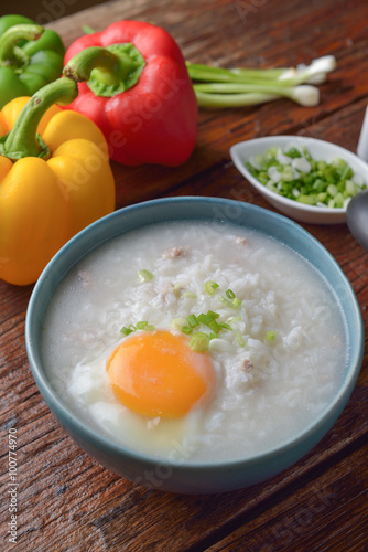 Thai chinese asian rice porridge with pork and egg  in  bowl, co