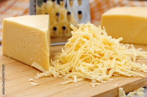 Obraz na plátně Grated cheese on the table