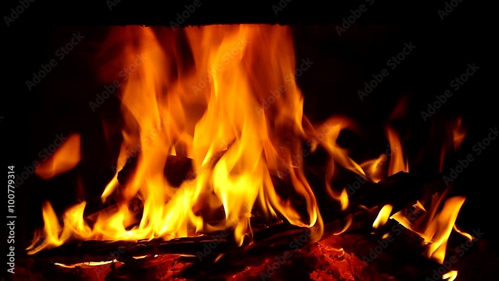Fire in fireplace. Closeup of firewood burning in fire Fire in fireplace. Closeup of firewood burning in fire