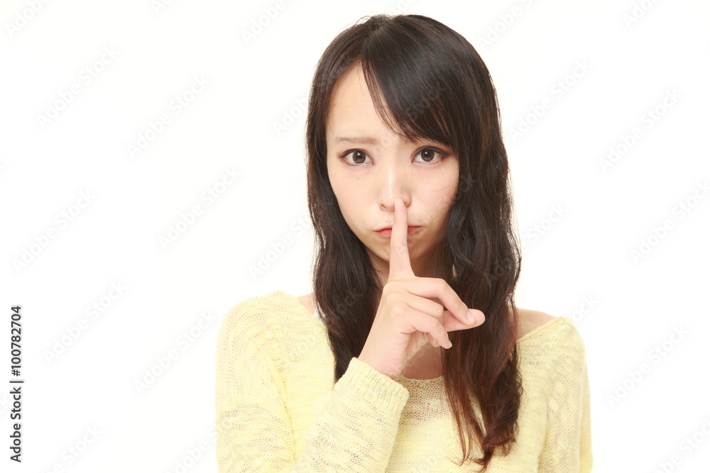 young Japanese woman whith silence gestures young Japanese woman whith silence gestures