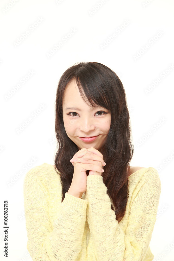 Japanese woman folding her hands in prayer Japanese woman folding her hands in prayer