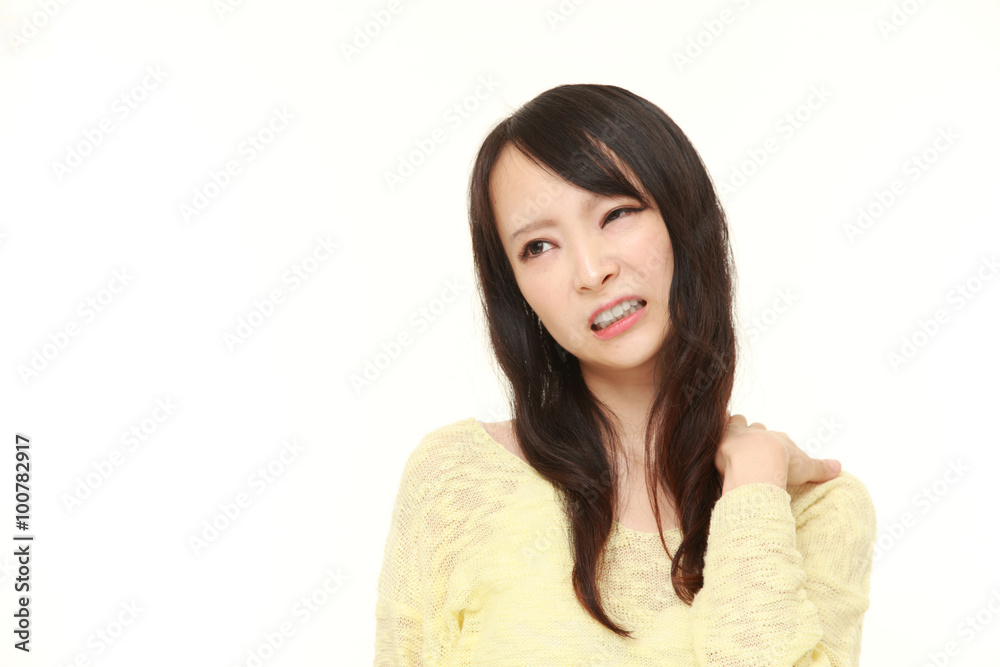 young Japanese woman suffers from neck ache young Japanese woman suffers from neck ache