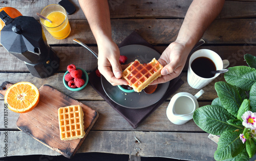 overhead photograph of person with breakfast waffles with marmal photo