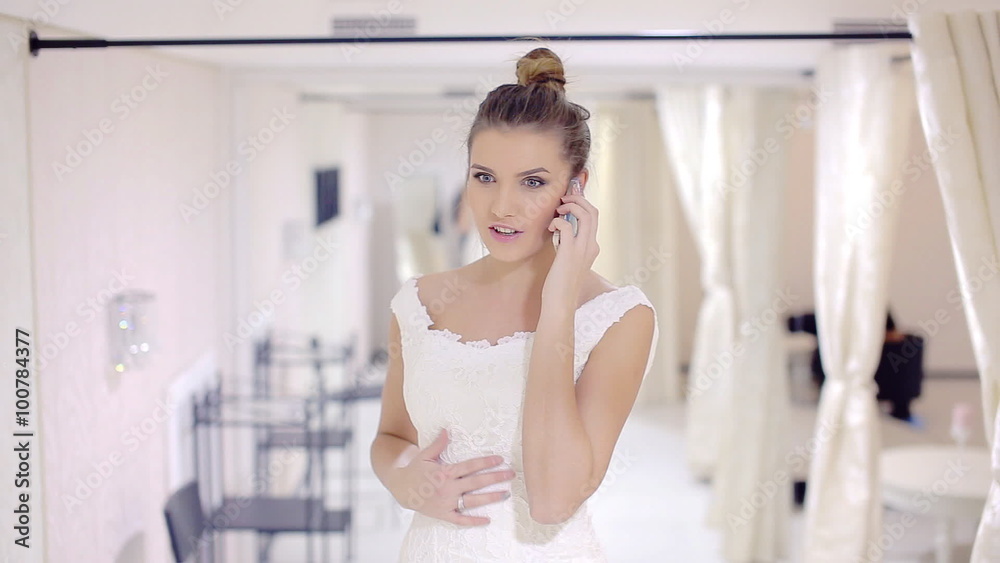 Happy bride talking on the phone Happy bride talking on the phone