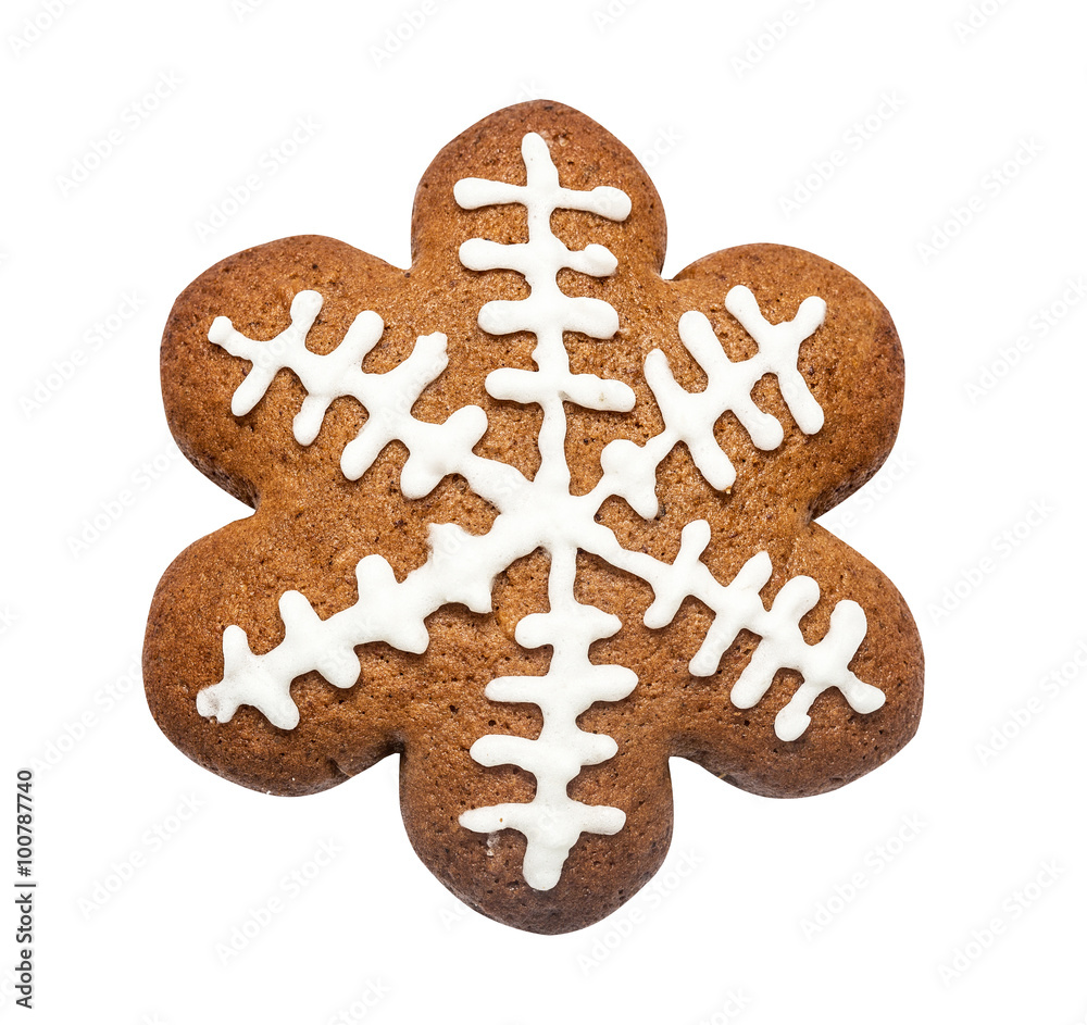 Gingerbread cookie made in the shape of a Christmas star (snowflake) isolated on the white Gingerbread cookie made in the shape of a Christmas star (snowflake) isolated on the white