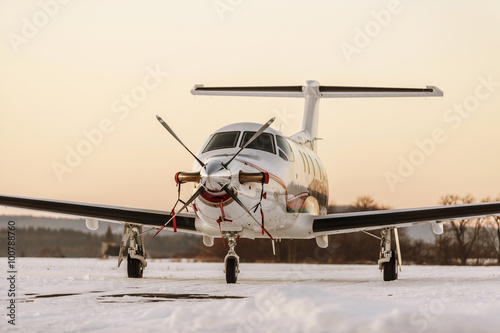 Fototapeta Naklejka Na Ścianę i Meble -  Single turboprop aircraft Pilatus PC-12 on winter runway. Pribra
