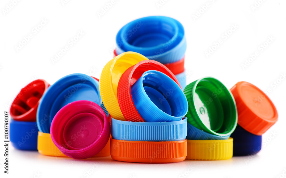 Composition with plastic bottles and caps isolated on white Composition with plastic bottles and caps isolated on white