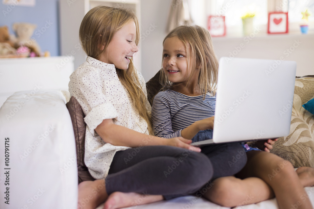 Girls having fun with using the laptop Girls having fun with using the laptop