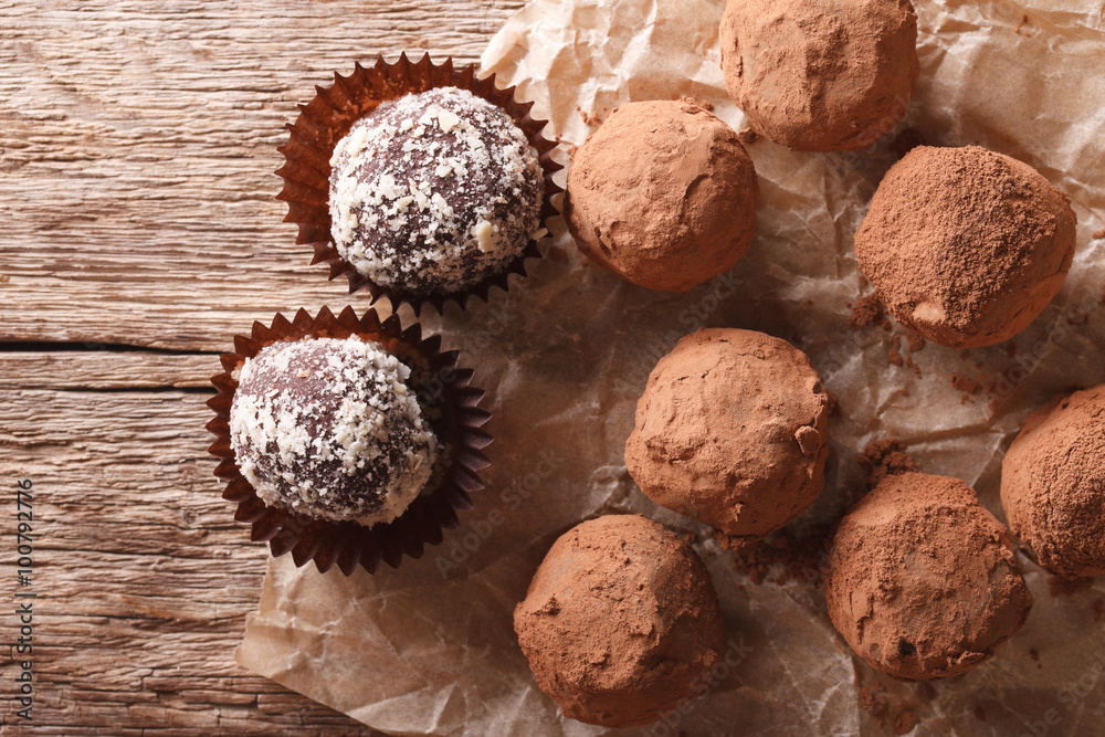 Chocolate truffles in a rustic style. horizontal top view
Chocolate truffles in a rustic style. horizontal top view
