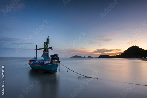 Samphraya Beach  Thailand  fishing boat parked on the beach   background is twilight sky at sunrise time with reflection sky long exprosure