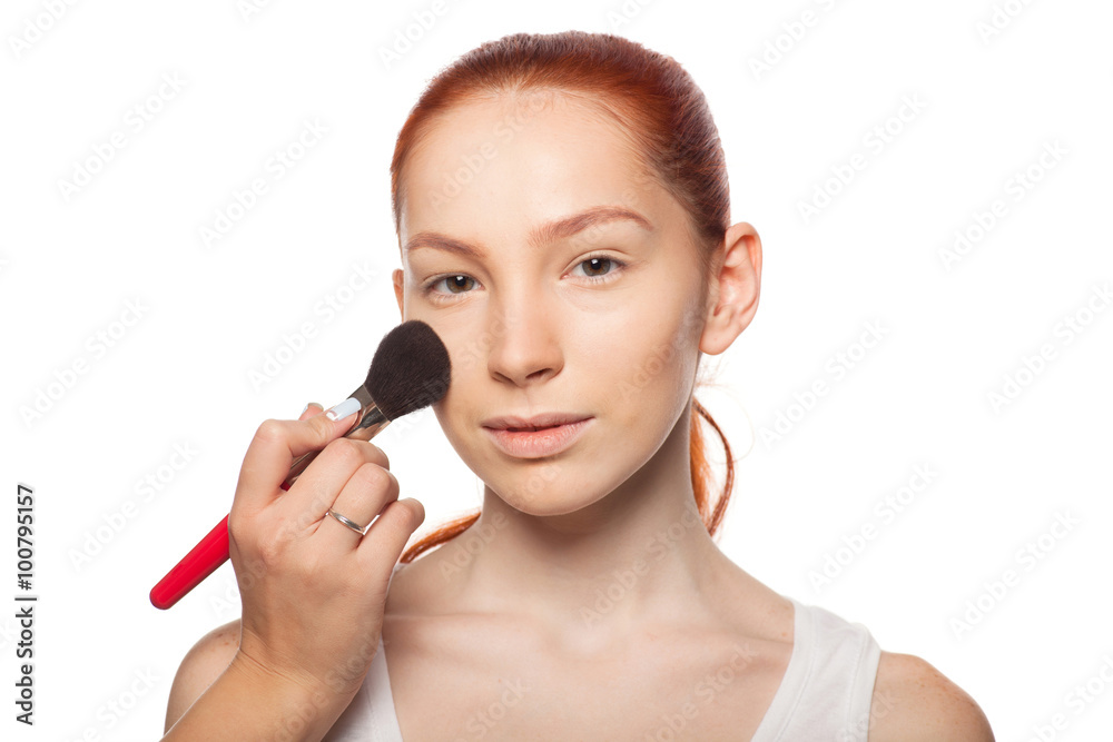 Professional Make-up artist doing glamour with red hair model makeup. Isolated background. Professional Make-up artist doing glamour with red hair model makeup. Isolated background.