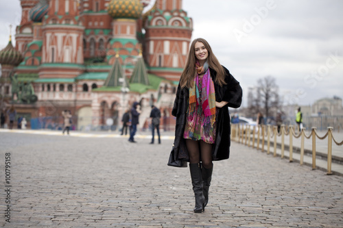 Young woman in a mink coat on the Red Square in Moscow