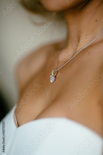 pendant on the neck of the bride