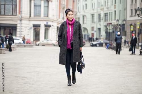 Young beautiful asian woman in stylish gray coat