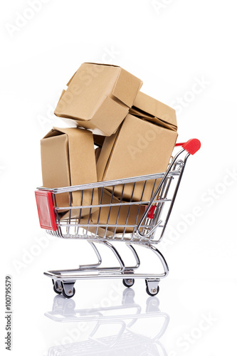 Shopping cart full of cardboard boxes, isolated on white backgro
