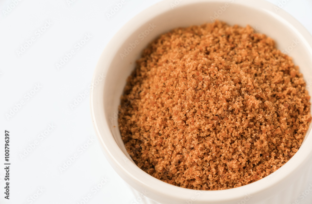 Coconut sugar in a cup with white background Coconut sugar in a cup with white background
