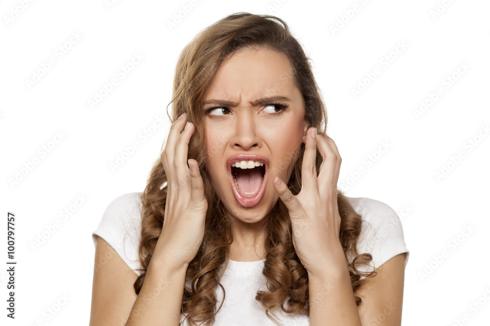 angry and mad pretty girl on a white background angry and mad pretty girl on a white background