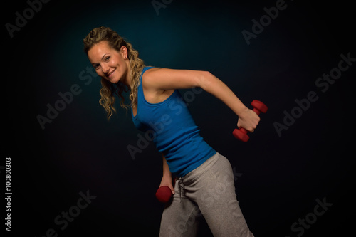 young woman exercising in the gym © bereta
