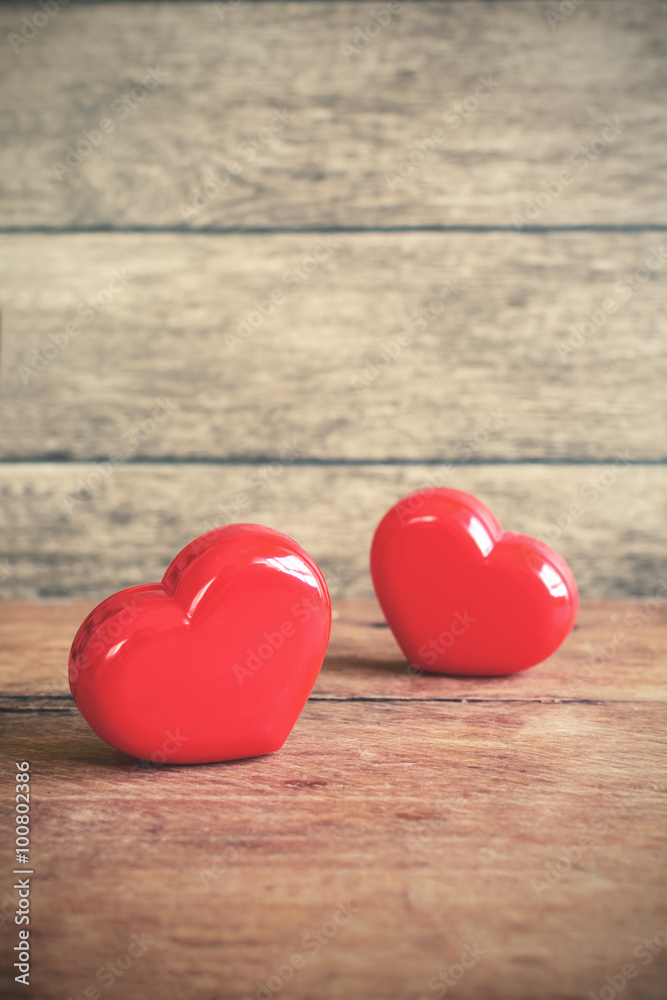Fototapeta premium Red heart shape on old wooden background