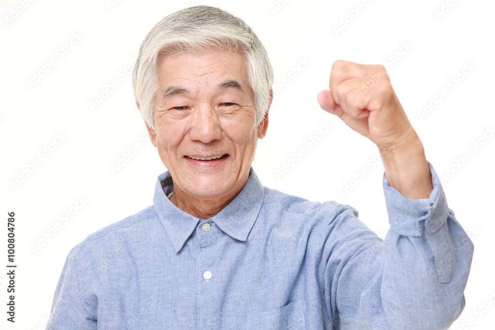 senior Japanese man in a victory pose senior Japanese man in a victory pose